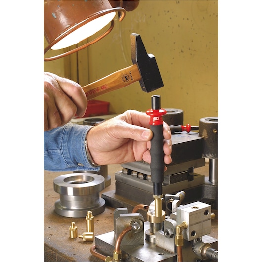 Facom 200H_60 hand tool with red and black handle used in workshop with hammer on metal assembly.