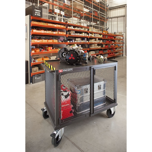 Facom 2703 industrial rolling storage cart with mesh sides, tools and parts, front angle photo in workshop.