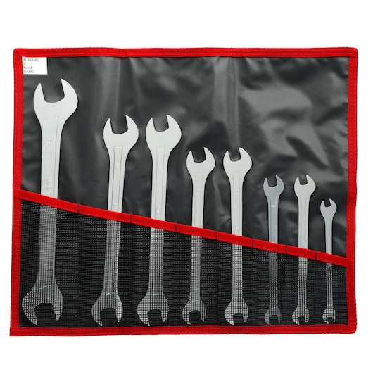 Facom wrench set SKU 31_JE8T, eight silver wrenches in black and red roll-up pouch, top view.