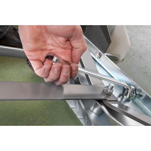 Facom 41_11 combination wrench adjusting metal bolt, close-up photo of tool in use.