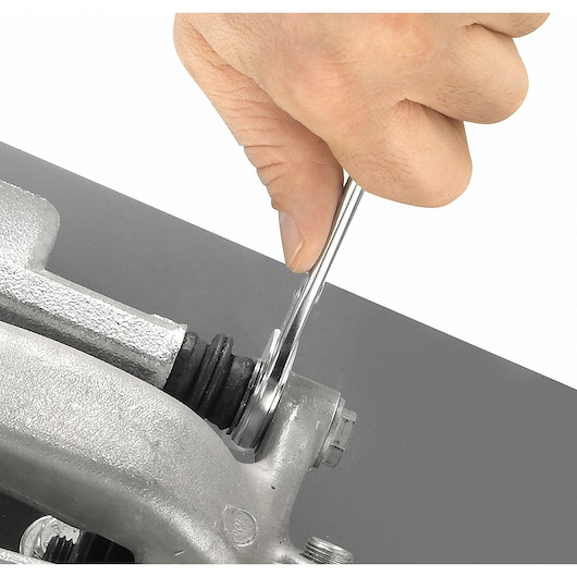 Facom wrench SKU 440_33 used on a silver metal bolt, close-up angle, product photography