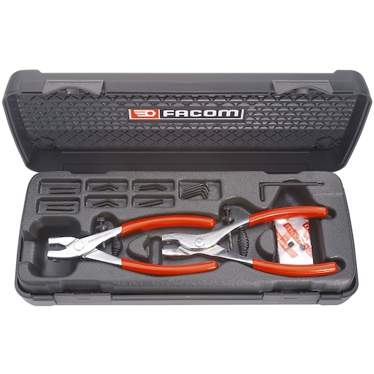 Facom 470 pliers set with red handles in a black hard case, top view on white background.