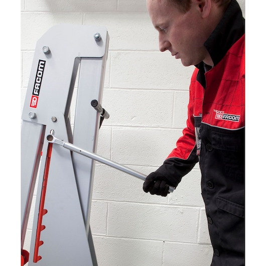 Facom 54M2B photography of technician using silver torque wrench on machinery in workshop.