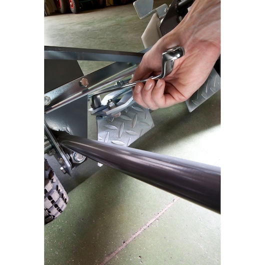 Facom 55A17X19 ratchet wrench being used on a metal mechanism, close-up photography.