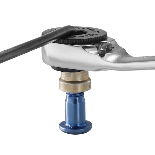 Facom 65PE ratcheting tool close-up on white background showing gear head and metal fitting.
