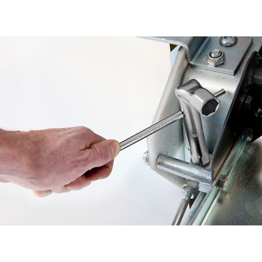 Photo of Facom 92A_22 T-handle socket wrench being used to tighten a bolt on a metal assembly.