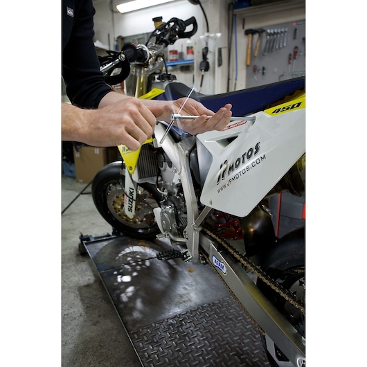 Facom 98B_12 T-handle hex key tool in use for motorcycle maintenance, garage setting.