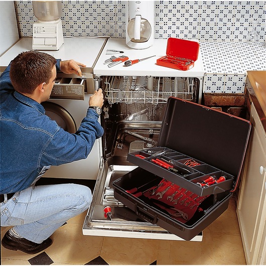 Facom tool case BV_21ST with organized hand tools, open in kitchen, used for appliance repair.