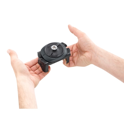 Facom C48-1 black camera mount held in two hands, showing top and side details, studio white background.