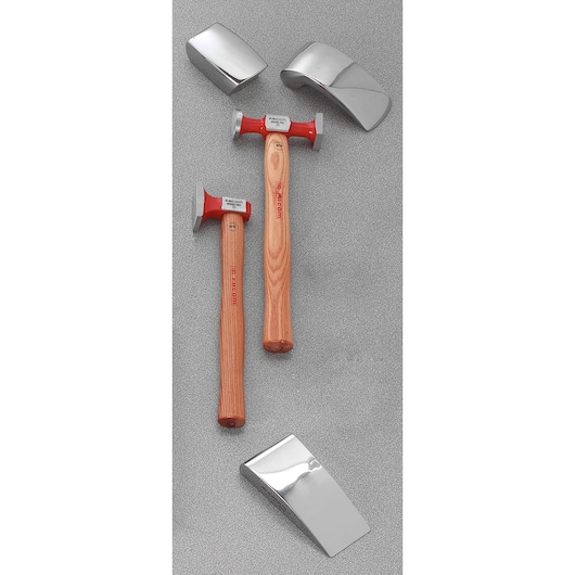 Facom CR858J5 bodywork hammer and dolly set with two hammers and three polished dollies, top-down view.