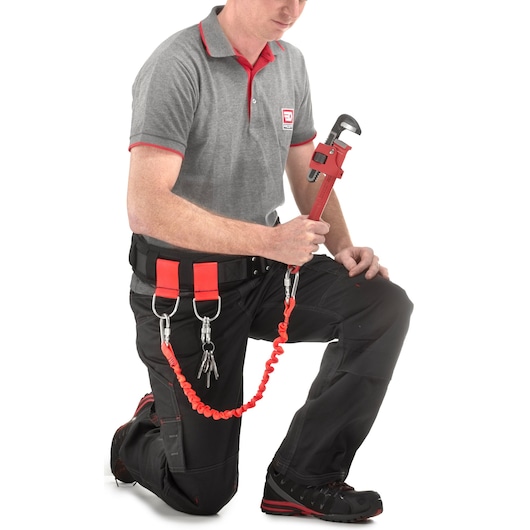 Facom CT100-140 photography of tool lanyard kit attached to a belt with keys and wrench, side angle.