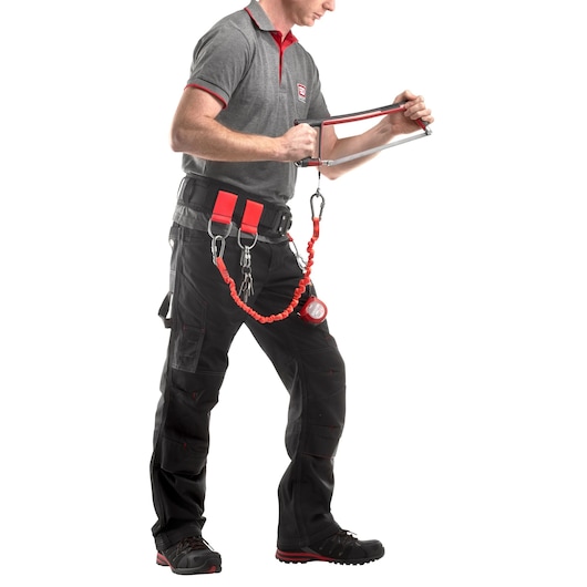 Facom CT100-140 tool lanyard attached to technician’s belt, holding a hand tool, side view on white background.