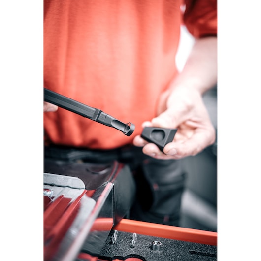Facom DX_TSCANPB magnetic tool attachment held by person above red tool drawer.
