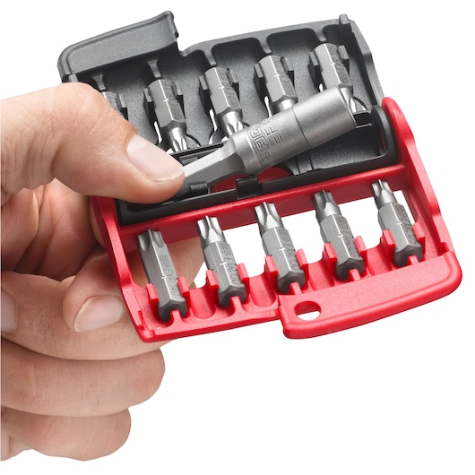 Facom E110 compact screwdriver bit set with red case, held in hand, photography on white background.