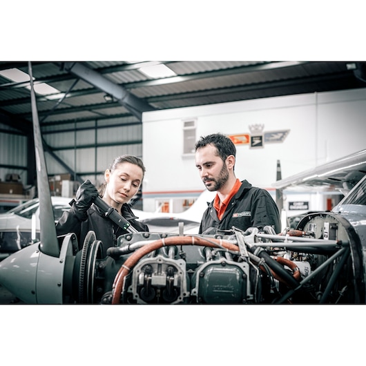 Facom E_516ST-340PB photography of two mechanics inspecting aircraft engine in hangar setting.