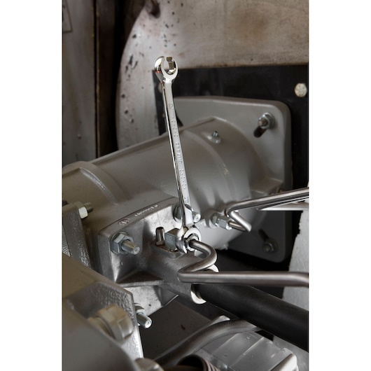 Facom E117368 combination wrench in use on industrial machinery, metallic finish, product photograph