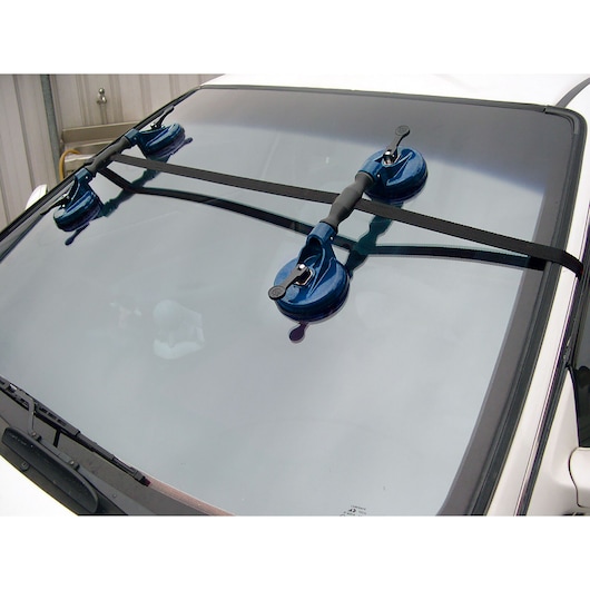 Facom E201502 windshield suction cup tool photography, front view on car window.