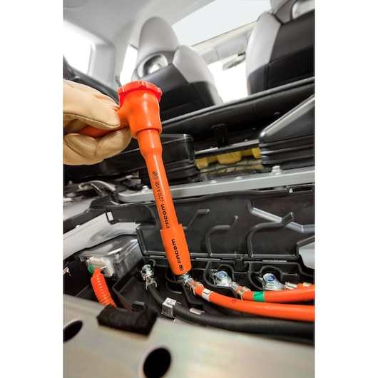 Photo of Facom J_151AVSE insulated socket wrench used on vehicle battery cables.