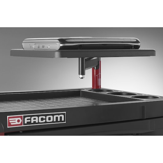 Facom JET_A3 tool trolley upper tray with black laptop on raised shelf, side view on white background.