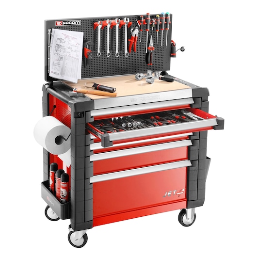 Facom JETA6M3 red and black mobile tool cabinet with open drawer, pegboard with tools, paper holder, and bottles, front angle.