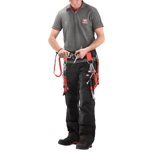 Facom MOUSQ8X80SLS tool belt with safety lanyards, photographed on person in work uniform, front view.