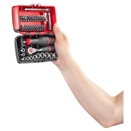 Facom R_360NANO compact socket set with ratchet and bits, black and red, held in hand, front view.