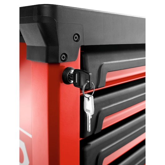 Facom ROLL.6M3A tool chest close-up with key in lock, red and black drawers, front angle, white background.