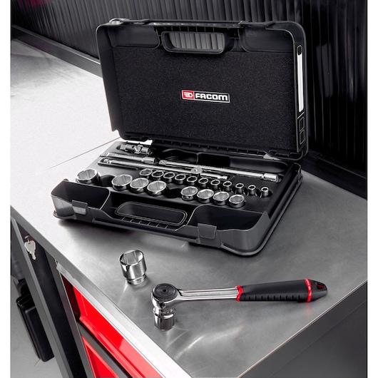 Facom socket set S.161-4P6PB with ratchet and sockets in open black case on metal workbench, angled view.