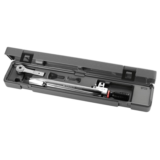 A Facom torque wrench set in a grey plastic case, showing the wrench and additional accessories neatly organized inside.
