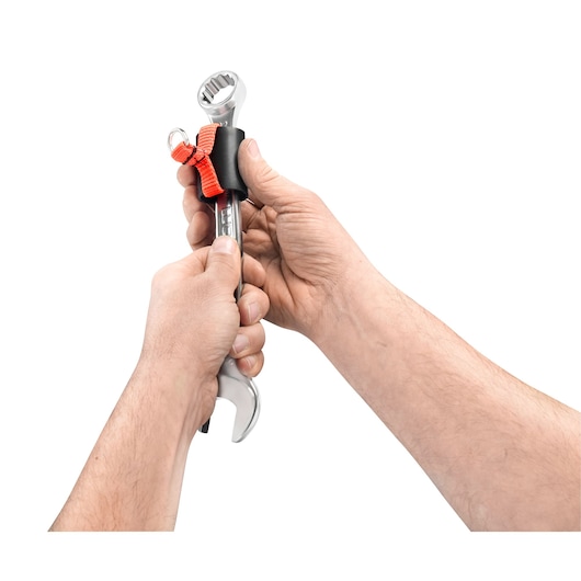 Facom SLS_G13 safety lanyard attachment on wrench, two hands securing red strap, close-up, white background.