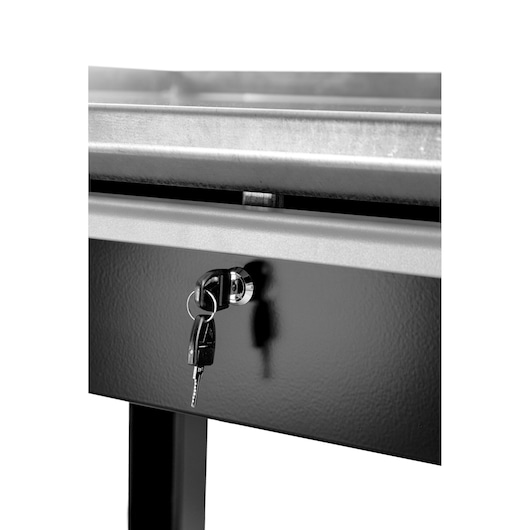 Facom WB2.1500DRAW drawer lock with key, close-up photography of black metal drawer front and lock.